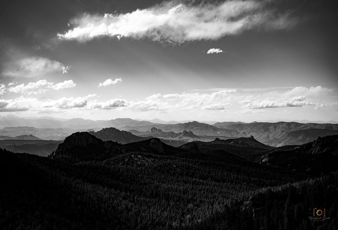 Black and White photograph of Rampart Range vast mountain rage from a high vantage point